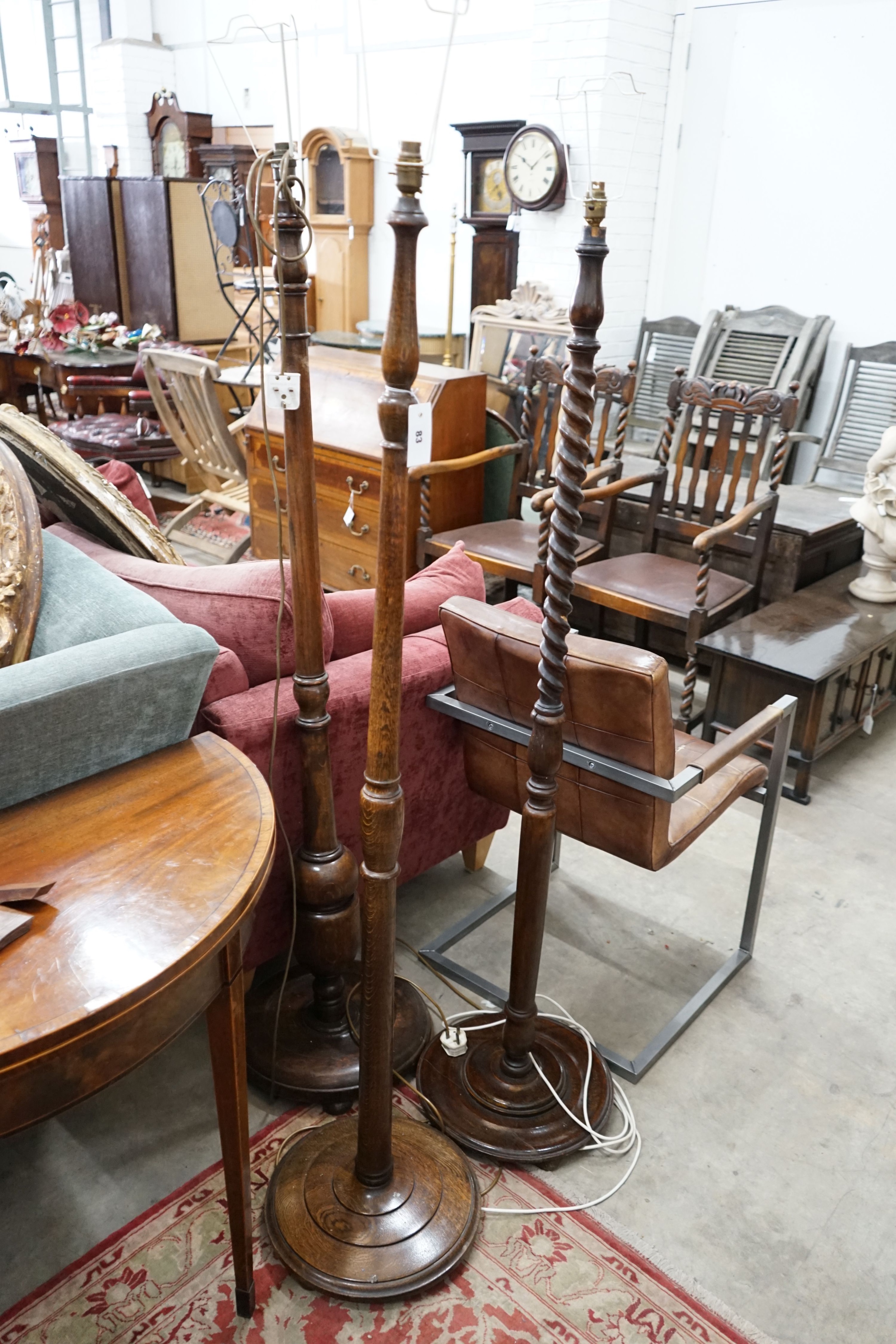 Three various oak standard lamps (excluding shades)